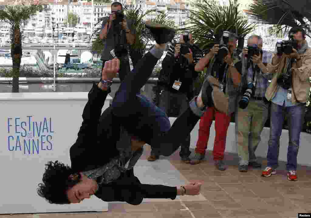 Cast member Rachid Youcef jumps during a photocall for the film Geronimo presented as part of the specials screenings at the 67th Cannes Film Festival in Cannes, southern France.