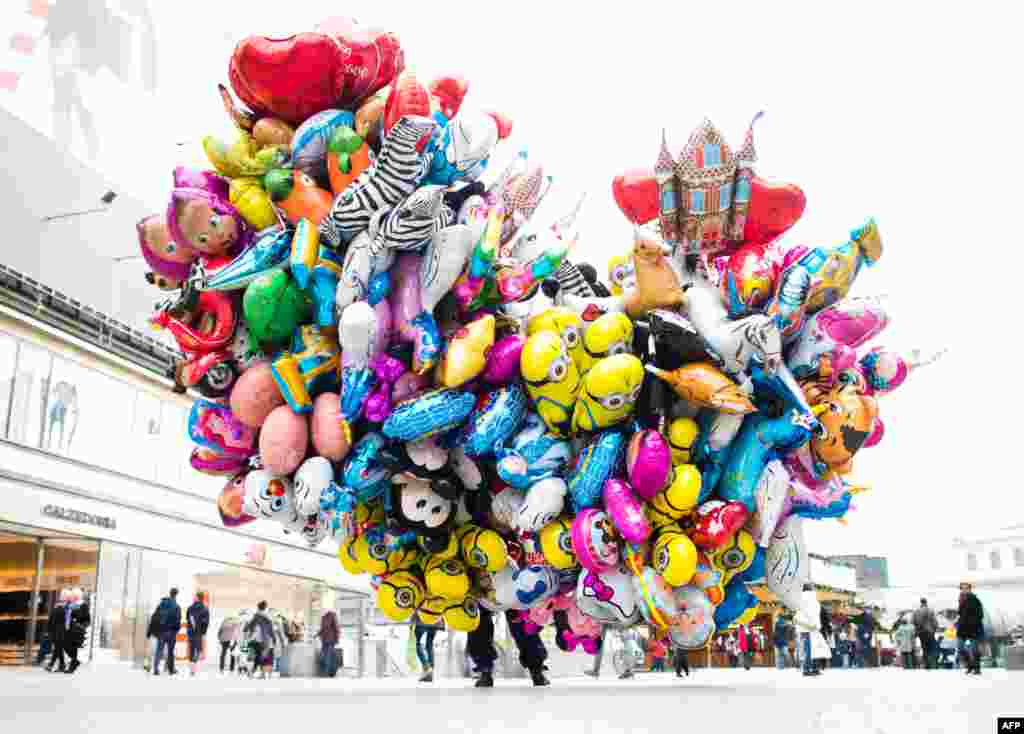 A man sells balloons in the city center of Hanover, central Germany. &nbsp;