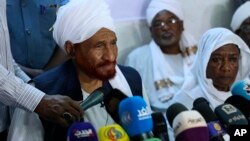 FILE - Leading Sudanese opposition figure Sadiq al-Mahdi, Sudan's last democratically elected prime minister, holds a news conference at the Umma Party House in Omdurman, Sudan, April 27, 2019.