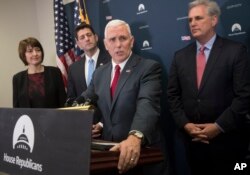 Vice President-elect Mike Pence, center, is joined by, from left, Rep. Cathy McMorris Rodgers, chair of the House Republican Conference, House Speaker Paul Ryan, and House Majority Leader Kevin McCarthy, at a news conference after a closed-door meeting with the GOP caucus at the Capitol in Washington, Jan. 4, 2017.
