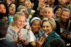 Democratic presidential candidate Hillary Clinton meets with attendees during a campaign stop, April 24, 2016, at the University of Bridgeport in Bridgeport, Conn.