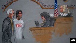 In this courtroom sketch, Khairullozhon Matanov (second from left) with attorney Paul Glickman (L) appears in federal court before Magistrate Judge Marianne B. Bowler (R), in Boston, May 30, 2014.