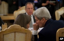 FILE - U.S. Secretary of State John Kerry, right, chats with Assistant U.S. Secretary of State for European and Eurasian Affairs Victoria Nuland, left, during a meeting with Russian Foreign Minister Sergey Lavrov, top, in Moscow Tuesday, Dec. 15, 2015.
