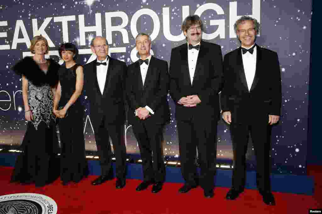 From left, Life Sciences laureates Jennifer A. Doudna, Emmanuelle Charpentier, Alim Louis Benabid, C. David Allis, Gary Ruvkun, and Victor Ambros arrive on the red carpet during the second annual Breakthrough Prize Awards at the NASA Ames Research Center in Mountain View, California, Nov. 9, 2014.