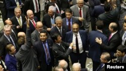 Deputies of the lower chamber of Brazil's Congress celebrate after they voted to reject a corruption charge against Brazilian President Michel Temer in Brasilia, Brazil, Aug. 2, 2017. 