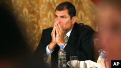 Ecuador's President Rafael Correa gestures during a news conference with the international press at the government palace in Quito, Ecuador, Wednesday Oct. 6, 2010. Correa contends the Sept. 30 police revolt, which trapped him in a hospital for over 12 h