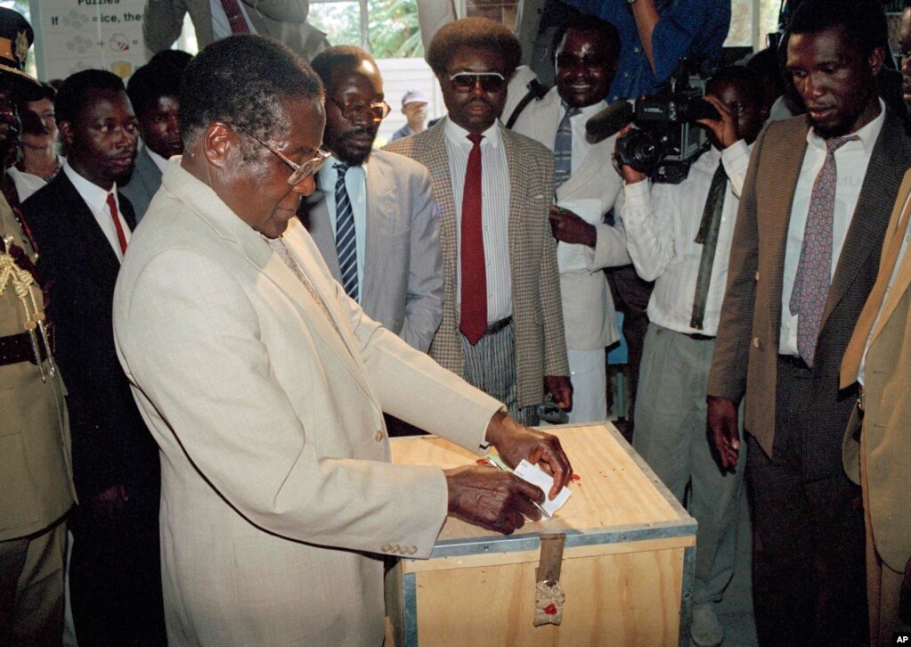 Robert Mugabe votes in a 1990 presidential election in Harare, Zimbabwe. (AP Photo)