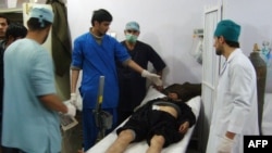Medical staff attend to a victim of the blast at the main hospital in Kunduz January 26, 2013.