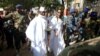 FILE - Gambian President Yahya Jammeh arrives at a polling station with his wife Zineb during presidential elections in Banjul, Gambia, Dec. 1, 2016. Jammeh has been demanding that the poll results be nullified.