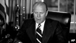 FILE - President Gerald Ford announces he has granted former President Richard M. Nixon "a full, free and absolute pardon" for all "offenses against the United States" during the period of his presidency in this Sept. 8, 1974 file photo.