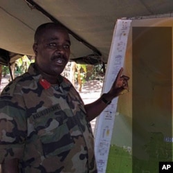 Col B briefs senior officers on the most recent engagements with the LRA, spanning DRC, Central African Rep. and S. Sudan. The map was marked "Secret" so we blurred it a bit (file photo)