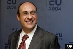 FILE - Then-European Commissioner for Justice and Home Affairs Antonio Vitorino smiles following a meeting between the EU and the U.S. in The Hague, Sept. 18, 2004.