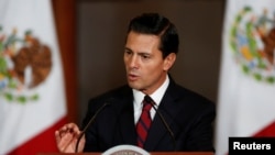 FILE - Mexico's President Enrique Pena Nieto speaks to the audience during a meeting with members of the Diplomatic Corps in Mexico City, Mexico, Jan. 11, 2017..