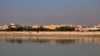 FILE - In this Friday, Jan. 3, 2020, file photo, the U.S. Embassy is seen across the Tigris River in Baghdad, Iraq. Iraq's military says two rockets hit Baghdad's heavily fortified Green Zone, the seat of the government and home to the U.S. Embassy. (AP P