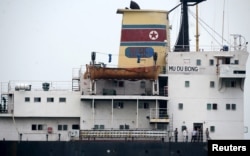 Crew members are seen on the 6,700-tonne freighter Mu Du Bong in the port of Tuxpan, April 9, 2015.