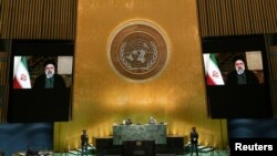 FILE - Iran's President's Ebrahim Raisi remotely addresses the 76th Session of the U.N. General Assembly in a pre-recorded video shown at U.N. headquarters in New York City, Sept. 21, 2021. Iran is among eight countries that have lost their viting rights 