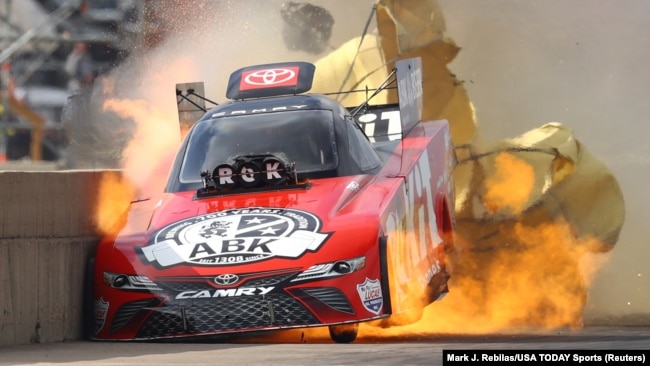 In Texas, race car driver Alexis DeJoria suffers an engine fire after winning her first-round matchup during the Fall Nationals at Texas Motorplex. She was uninjured in the fiery incident, Oct 18, 2020. (Mark J. Rebilas/USA TODAY Sports/Reuters)