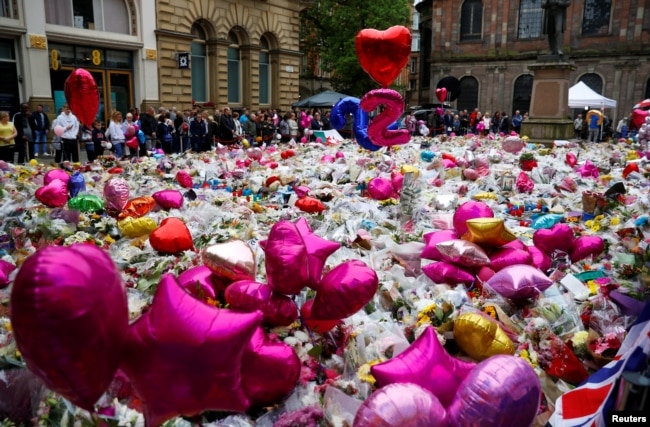 Flowers and tributes to the victims of the attack on Manchester Arena fill St Ann's Square in Manchester, Britain, May 29, 2017.