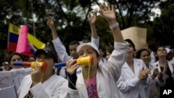 Public doctors and nurses protest to demand higher wages for public medical workers as well as better hospital maintenance in Caracas, Venezuela, Thursday June 16, 2011.