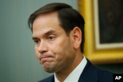 FILE - Sen. Marco Rubio, R-Fla., pauses as he speaks during a news conference.