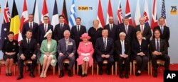 Britain's Queen Elizabeth II, accompanied by The Prince of Wales, pose for a formal photograph with leaders of the other Allied Nations ahead of the National Commemorative Event commemorating the 75th anniversary of D-Day, in Portsmouth, England, June 5,