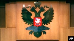 FILE - The Russian Double-headed Eagle is displayed inside the Foreign Ministry Building in Moscow.