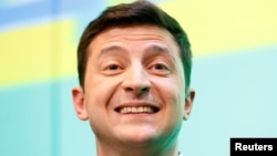Ukrainian presidential candidate Volodymyr Zelenskiy reacts during a news conference at his campaign headquarters following a presidential election in Kyiv, April 21, 2019.