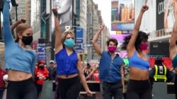 ILE PHOTO: Performers take part in a pop up Broadway performance in anticipation of Broadway reopening in Times Square amid the coronavirus disease (COVID-19) pandemic in the Manhattan borough of New York City, New York, U.S., March 12, 2021