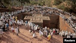 FILE - Ethiopian Orthodox pilgrims attend a prayer session at the monolithic Orthodox church ahead of Ethiopian Christmas in Lalibela, Ethiopia, Jan. 6, 2018. 