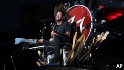 FILE - The rock band Foo Fighters — member Dave Grohl is pictured above, in a performance at New York's Citi Field — was one of a number of musical acts that canceled Paris shows in the wake of terrorist attacks that occurred Nov. 13, 2015. 