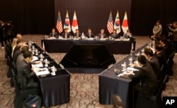 FILE - Delegation of South Korea, center, the United States and Japan, right, attend their trilateral meeting to coordinate strategies on North Korea, in Seoul, South Korea, Dec. 13, 2016.