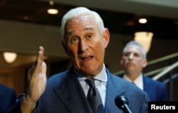 FILE - U.S. political consultant Roger Stone, a longtime ally of President Donald Trump, speaks to reporters after appearing before a closed House Intelligence Committee on Capitol Hill in Washington, Sept. 26, 2017.