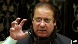 FILE - Nawaz Sharif, then leader of Pakistan's largest opposition party, gestures during a media conference in Islamabad, Pakistan.