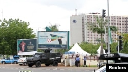 An armored vehicle is stationed outside the venue for the World Economic Forum on Africa (WEFA) meeting in Abuja, May 7, 2014. 