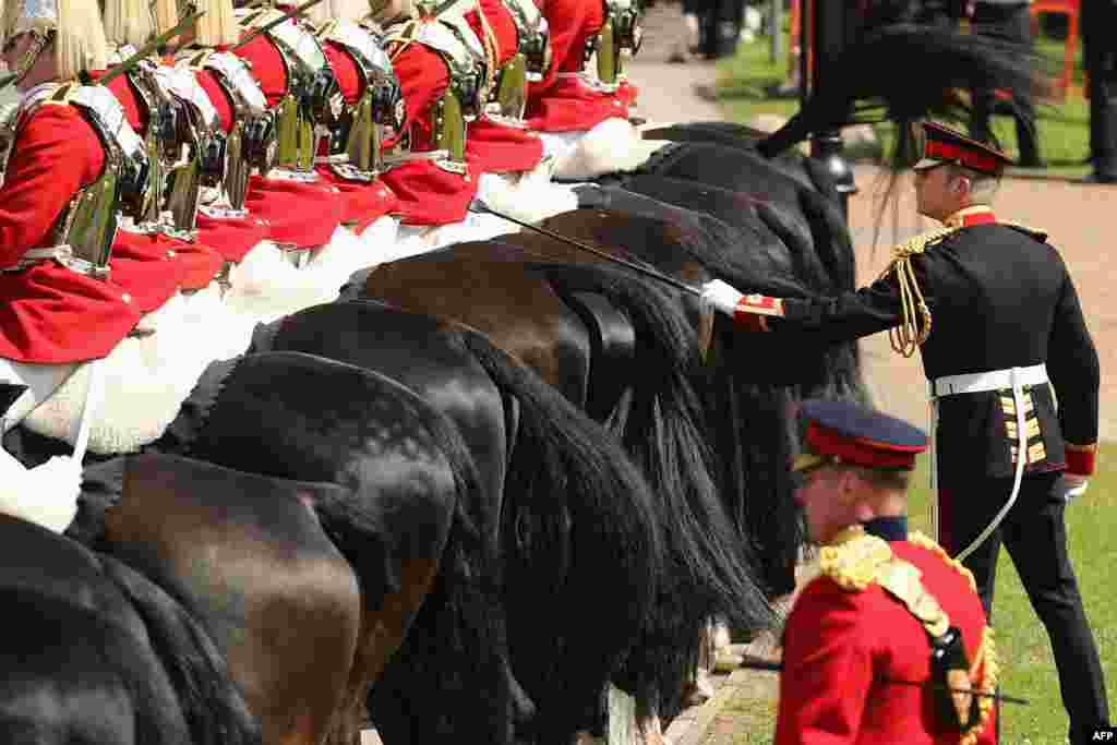 Members of the Household Cavalry are positioned during the ceremonial welcome for the state visit of Emirati President Sheikh Khalifa bin Zayed al-Nahayan in the grounds of Windsor Castle, Berkshire, west of London. 
