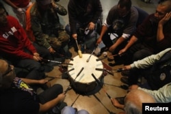 Native American drummers take part in a "victory pow wow" to celebrate with activists and veterans who had spent time in the Oceti Sakowin camp at the Standing Rock Indian Reservation, near Fort Yates, North Dakota, U.S., December 6, 2016.