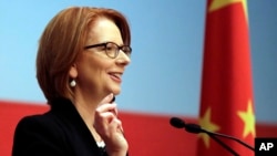 Australian Prime Minister Julia Gillard answers question from guests at China Executive Leadership Academy Pudong (CELAP) in Shanghai, China, Apr. 8, 2013. 