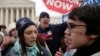 FILE - An abortion-rights supporter is confronted by an anti-abortion protester at a rally in front of the U.S. Supreme Court in Washington January 22, 2007.
