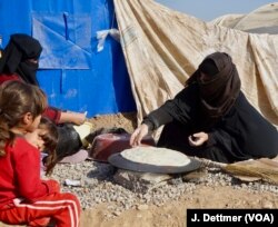 A displaced Sunni Arab family from Mosul. Kurdish officials say they are unsure who to trust in villages captured from ISIS.