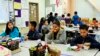 FILE - Students are served breakfast at the Stanley Mosk Elementary School in Los Angeles, California, April 8, 2015.