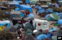 FILE - A view of the migrant camp known as the new Jungle in Calais, northern France, Oct. 21, 2015.