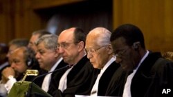 The court ruling is read out by presiding President Owada on whether it has the jurisdiction to hear Georgia's claim of Russian human rights abuses on its territory, in The Hague, April 1, 2011