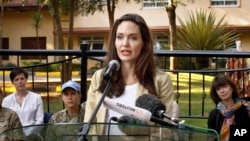 FILE - Actor-director Angelina Jolie speaks to reporters after meeting with the British Peace Support Team for East Africa, at the International Peace Support Training Center in Nairobi, Kenya, June 20, 2017. The activist spoke out against sexual violence