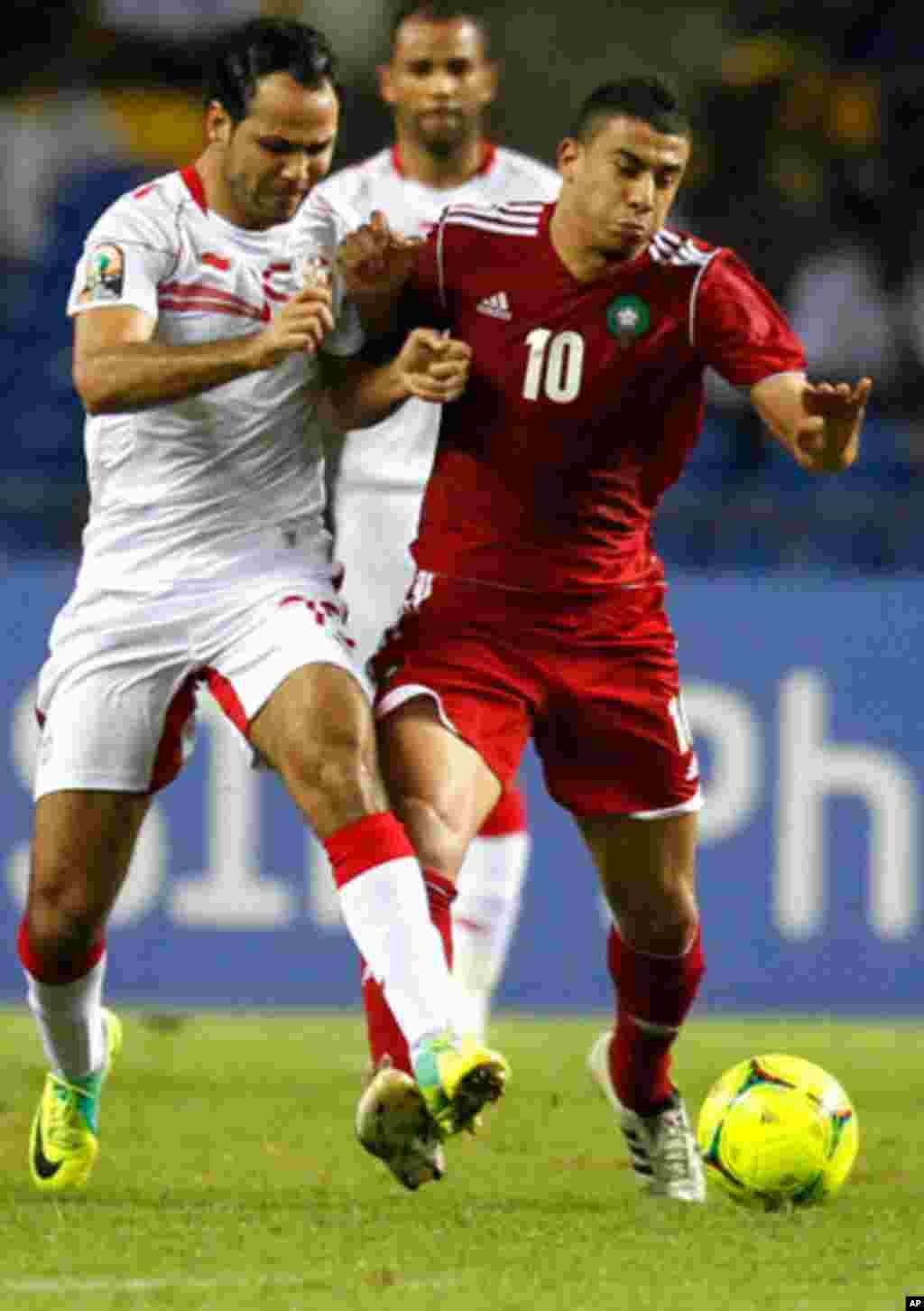 Morocco's Younes drives the ball past Tunisia's Zauhaier during their African Cup of Nations Group C soccer match at Libreville
