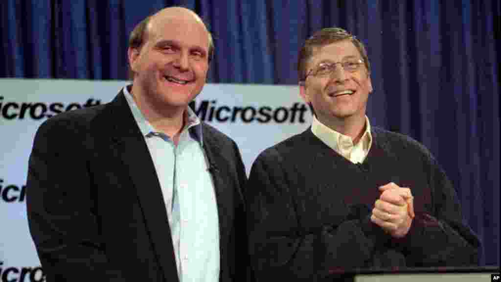 Microsoft's Steve Ballmer (L) and Bill Gates react to a question during a news conference, Jan. 13, 2000 in Redmond, Washington, where Gates announced that Ballmer will become the new chief executive officer.