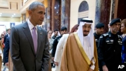 President Barack Obama and Saudi Arabia's King Salman walk together to a meeting at Erga Palace in Riyadh, Saudi Arabia, April 20, 2016. 