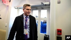 CNN's Jim Acosta enters the Brady press briefing room upon returning to the White House in Washington, Nov. 16, 2018. 