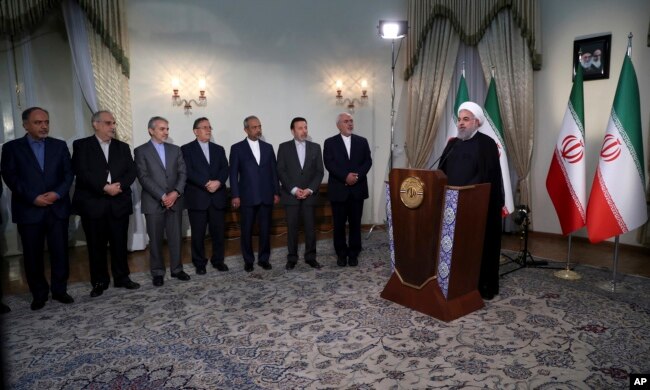 In this photo released by official website of the office of the Iranian presidency, President Hassan Rouhani addresses the nation in a televised speech in Tehran, May 8, 2018.