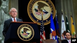 Attorney General Jeff Sessions speaks during a Religious Liberty Summit at the Department of Justice, July 30, 2018. Seated on the right is Deputy Attorney General Rod Rosenstein.