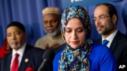 FILE - American Muslim Alliance Washington, D.C. National Director Mahdi Bray, (from left) Muslim Alliance of North America Imam Johari Abdul-Malik, Muslim Public Affairs Council Media and Communications Director Rabiah Ahmed, and Executive Director and Founder of the Council on American-Islamic Relations Nihad Awad, attend a press conference held by the U.S. Council of Muslim Organizations at the National Press Club in Washington, Dec. 21, 2015, to announce major initiatives to address growing islamophobia in America.